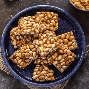 a plate of ZestBites Jaggery Peanut Chikki Bars