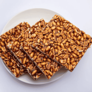 a plate of ZestBites Jaggery Peanut Chikki Bars