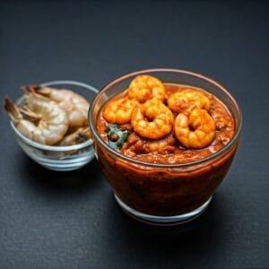 a bowl of zestbites Prawn pickle with spices and herbs bowl of fresh prawns